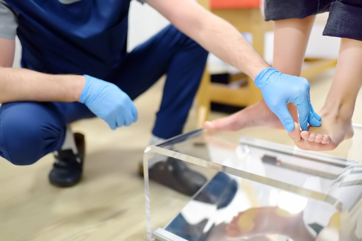 Doctor inspecting patient's foot.